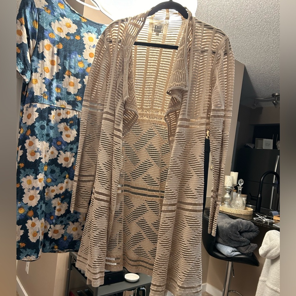 Beautiful, shear beige sweater. Beautiful pattern throughout.